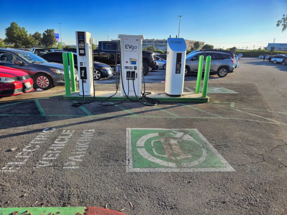 EVgo DC fast charging dispensers and parking stalls painted with electric vehicle symbols