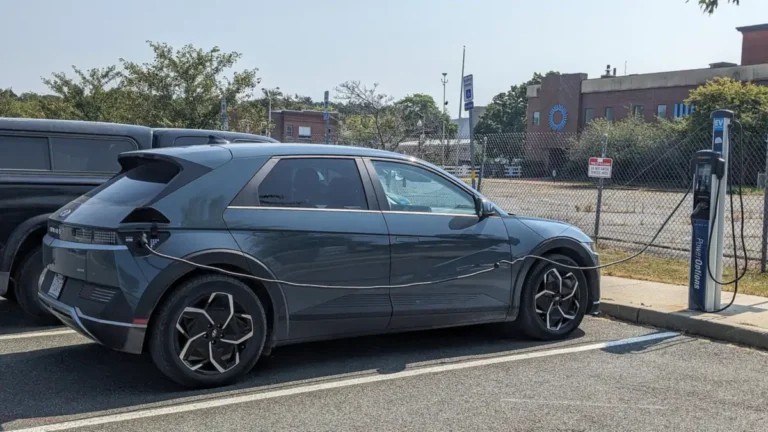 Gray Hyundai Ioniq 5 charging at a public ChargePoint Level 2 station in a municipal parking lot