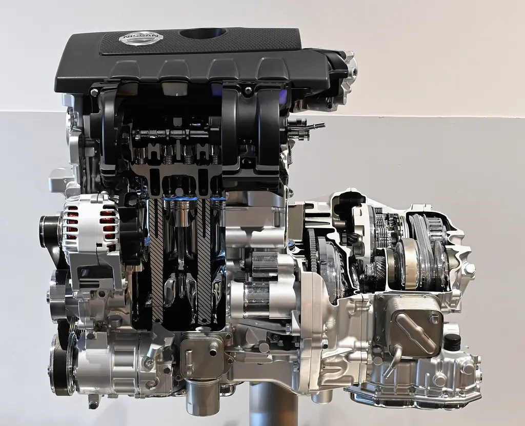Cutaway of a Nissan MR-series four-cylinder engine and CVT, showing the belt and pulleys, on display at Nissan's engine museum