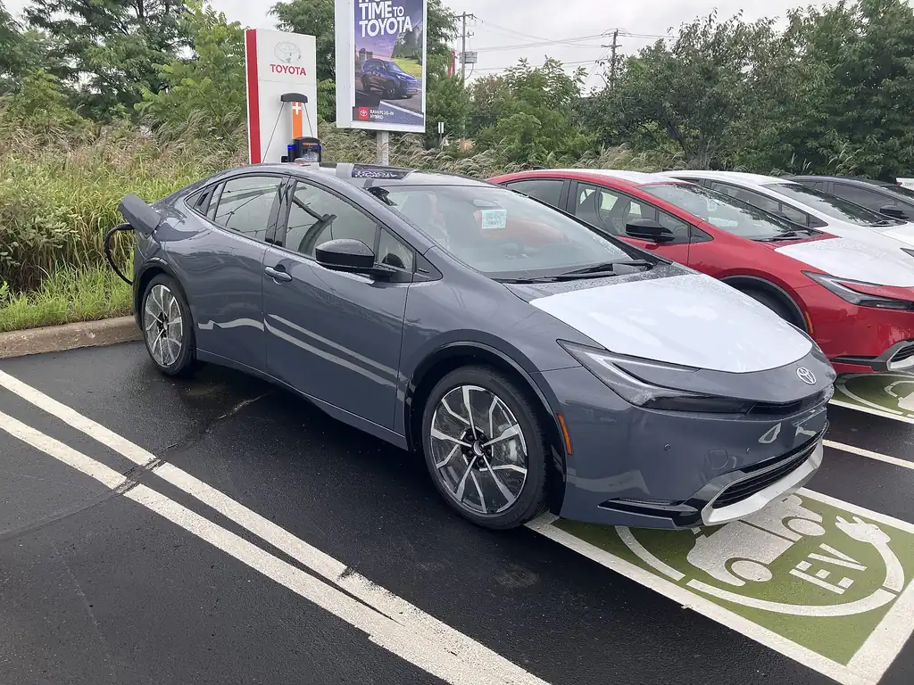 Toyota Prius Plug-in Hybrid plugged into a public charging station