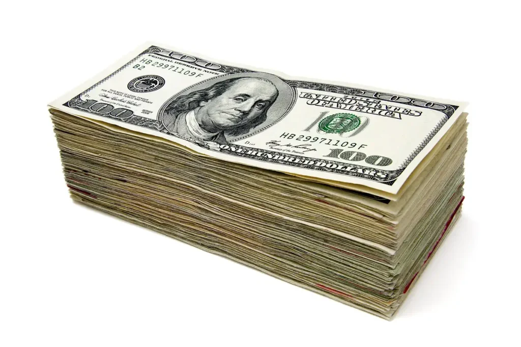 U.S. dollar bills saved for a car down payment (Wikimedia Commons, CC BY 2.0)