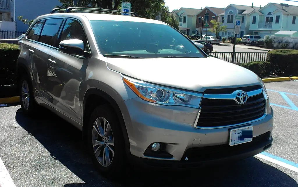 Beige third-generation (XU50) Toyota Highlander SUV parked in a parking lot