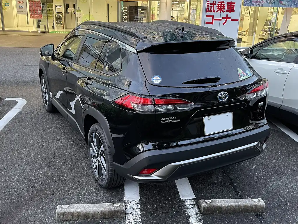Toyota Corolla Cross Hybrid - rear 3/4 exterior, black