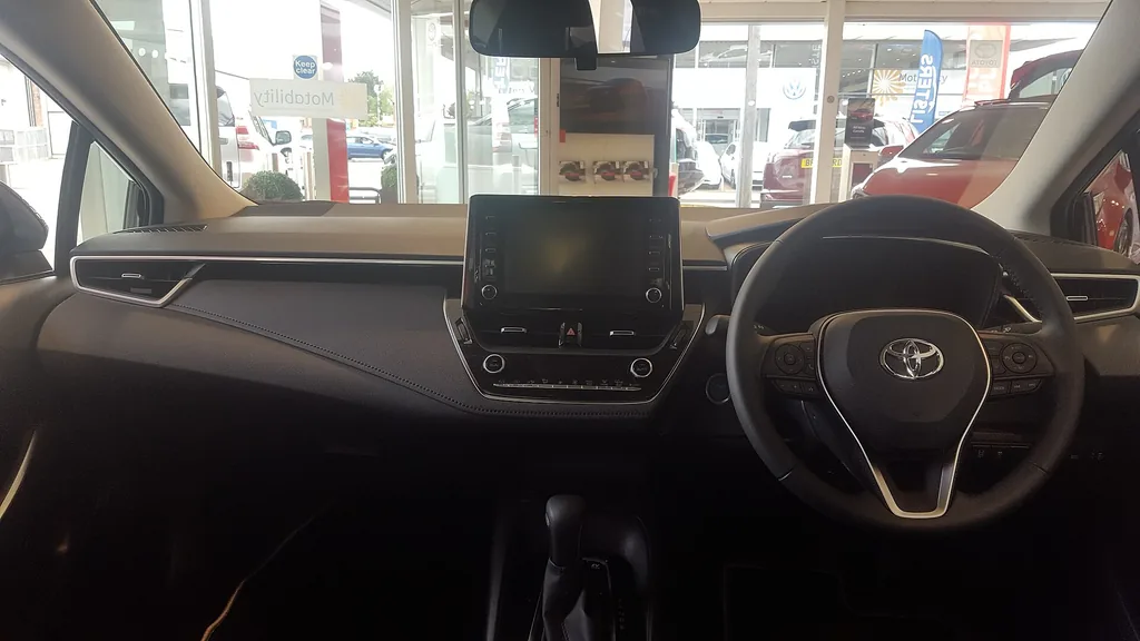 Toyota Corolla Hybrid sedan (E210) - dashboard and front cabin (UK right-hand-drive)