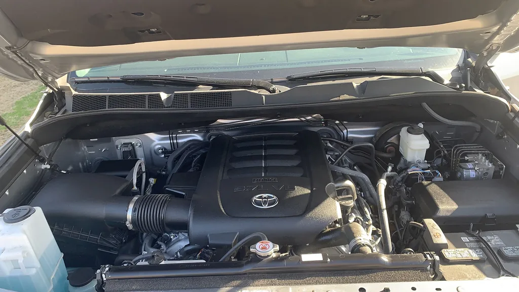 Engine bay of a 2020 Toyota Tundra showing the 5.7-liter i-Force V8 engine cover